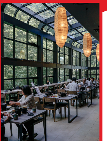 A restaurant with counter top self ordering kiosk